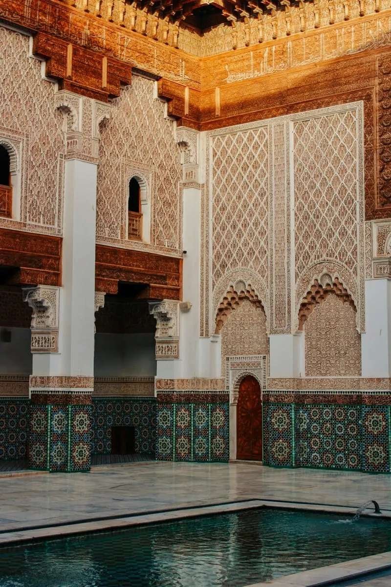 Intricate mosaic courtyard of Ben Youssef Madrasa - masterpiece of Islamic architecture