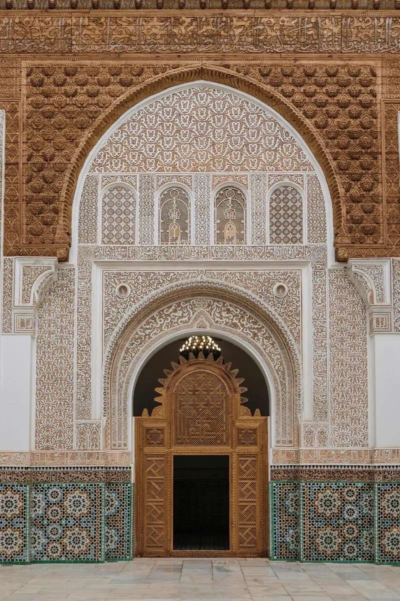 Intricate arch detail at Ben Youssef Madrasa - Islamic architecture masterpiece