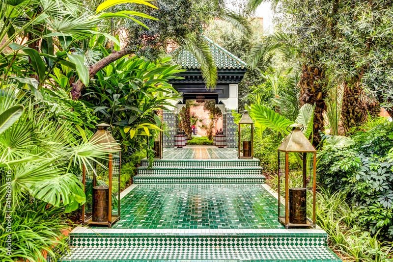 Lush riad garden with traditional green zellige tiles - Marrakech tranquility