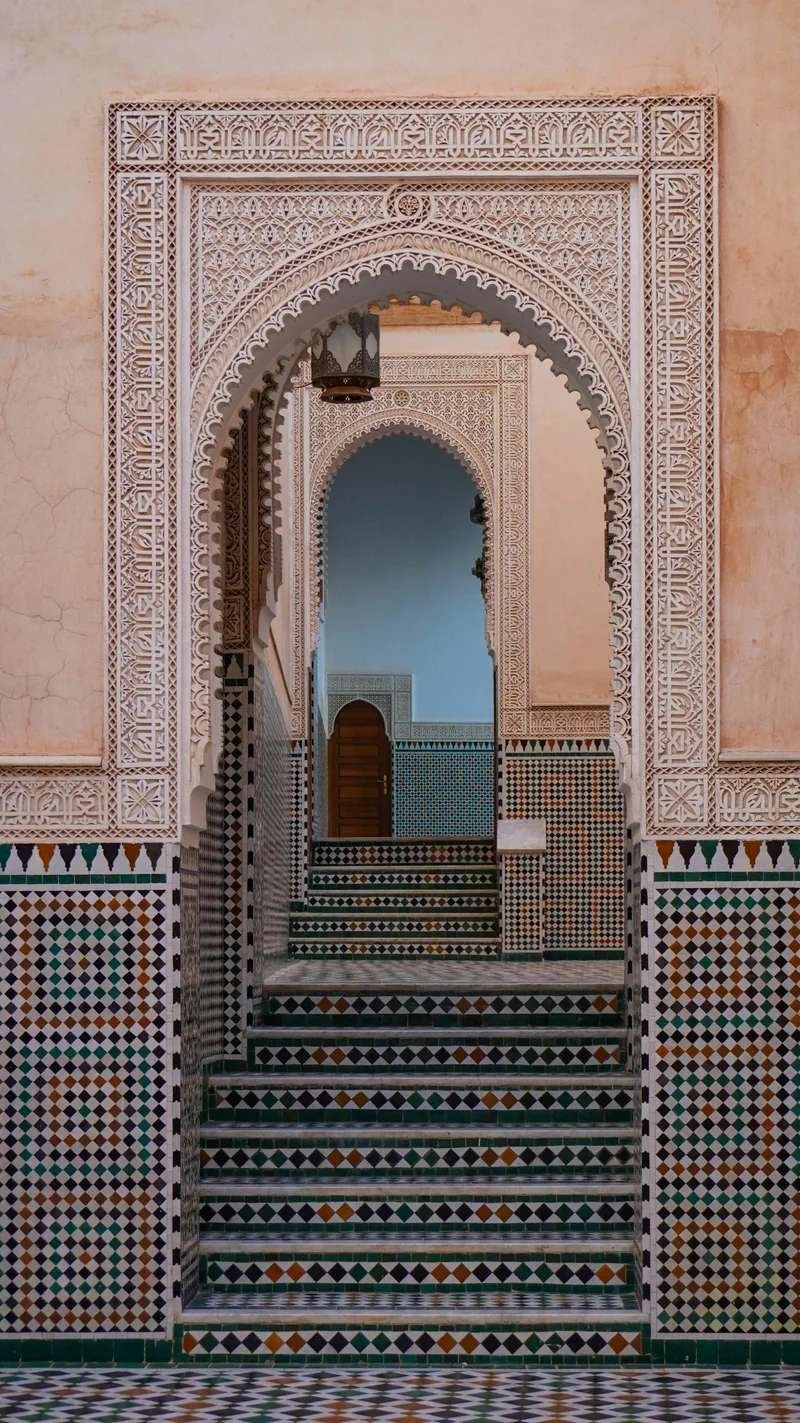 Marrakech riad interior with traditional arches and zellige tilework