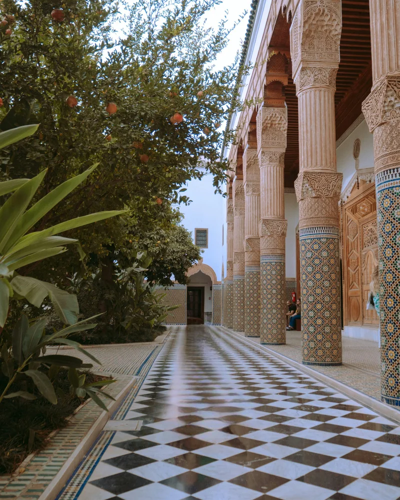 Detailed zellige tilework in riad courtyard showing traditional Moroccan craftsmanship quality