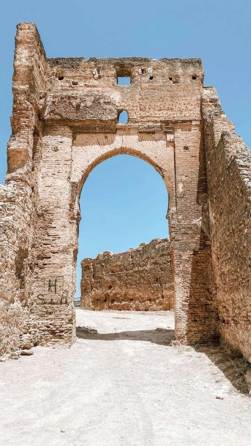 Traditional Moroccan medina archway with steps