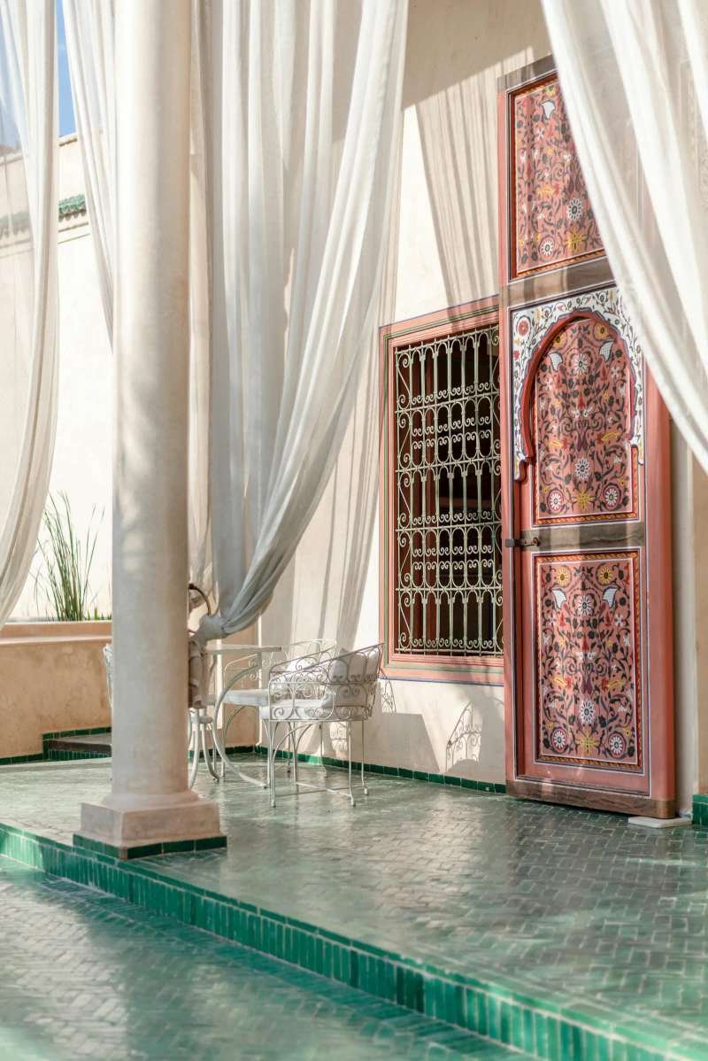 Riad terrace with traditional green zellige tiles - rooftop retreat
