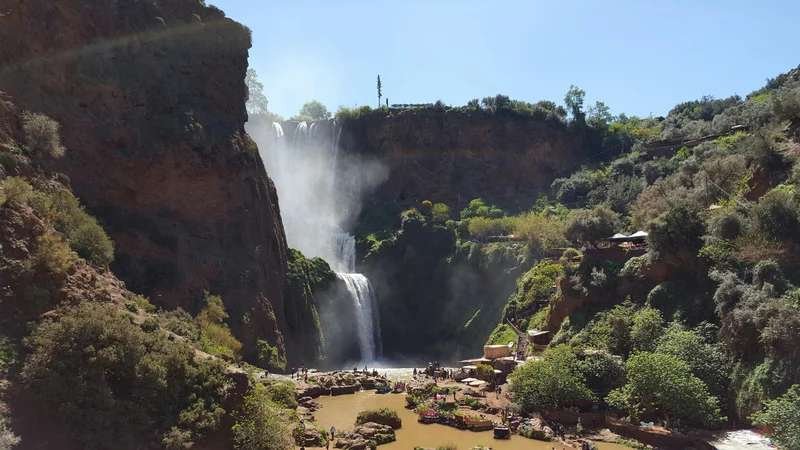 Stunning Ouzoud Waterfalls surrounded by lush greenery - Atlas Mountains nature experience