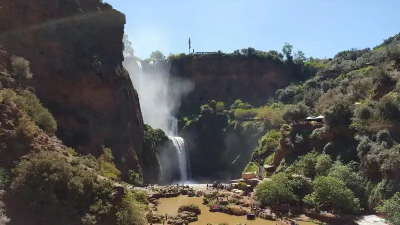 Ouzoud waterfalls surrounded by lush green vegetation, showing Morocco at its most verdant in spring