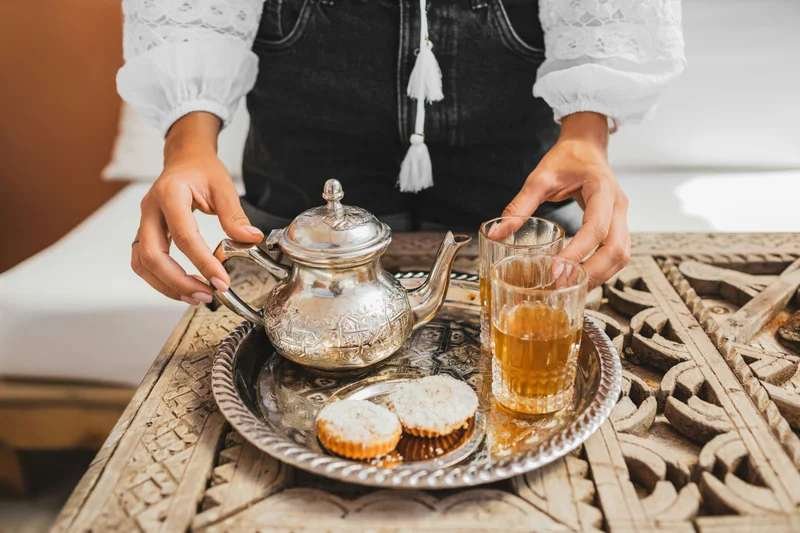 Traditional Moroccan mint tea being poured - hospitality ritual