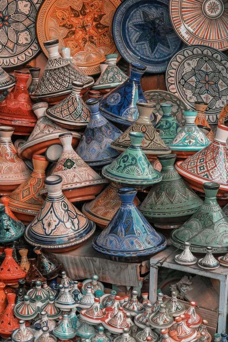 Colorful ceramic tagines in traditional pottery market