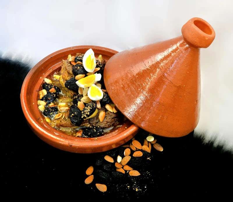 Traditional lamb tagine with prunes and almonds - authentic Moroccan cuisine
