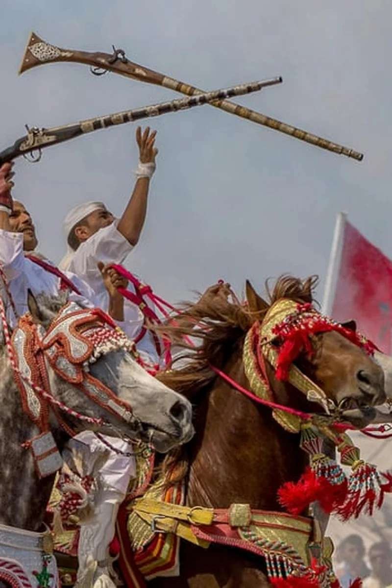 Traditional Moroccan fantasia with horse riders - living cultural heritage